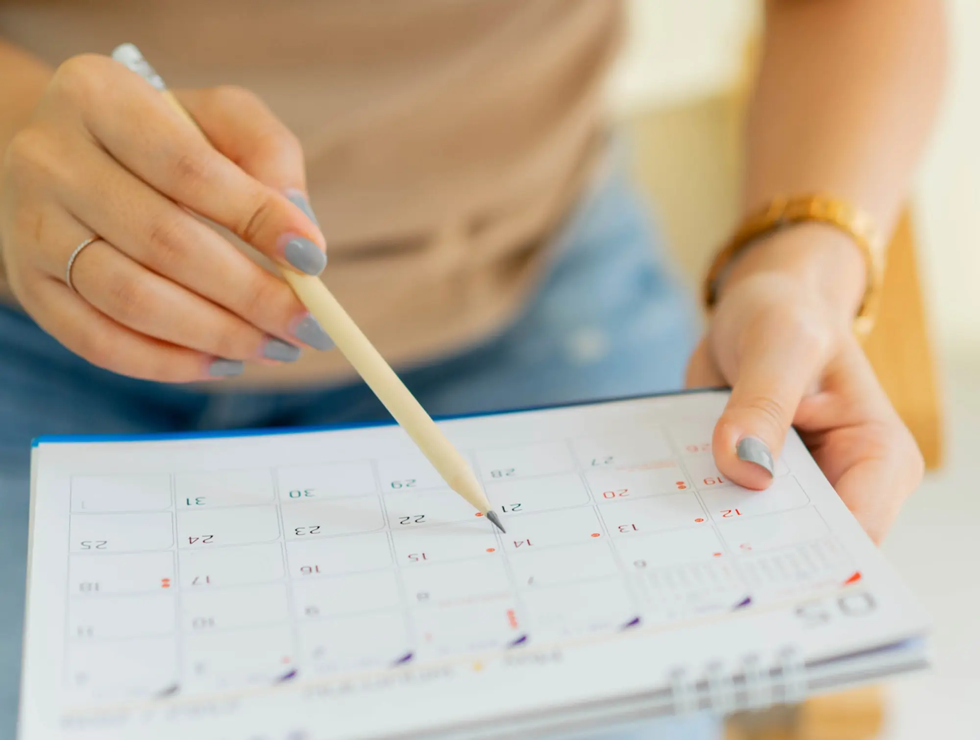 Woman looking at calendar.